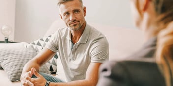 man getting advice from his therapist