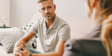man getting advice from his therapist