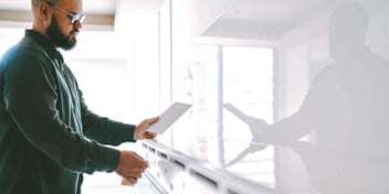 man looking at mail