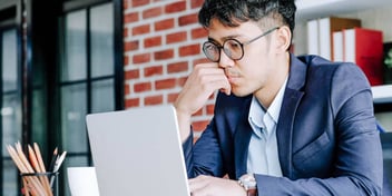 Man looks over his spousal support while in an office