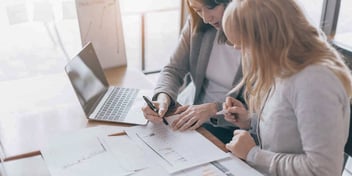 mediator helping client go over her divorce agreement