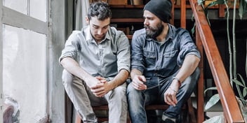 two men sitting on stairs talking about divorce