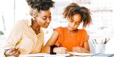 mother and daughter working on homework together