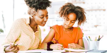 mother and daughter working on homework together