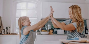 mom and daughter doing a high-five