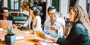 workers collaborating on their computers