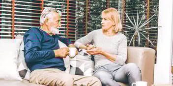 couple having a serious conversation on couch