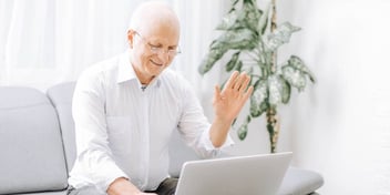 older man using laptop