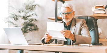 man reading over his divorce decree