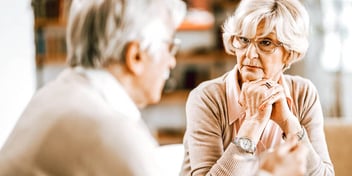 retired couple having a serious conversation