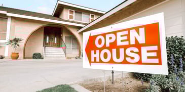 open house sign outside a nice house