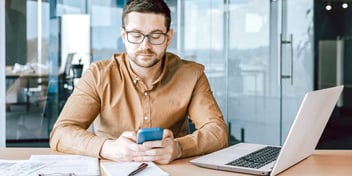 dude scrolling through his mobile phone