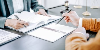 people going over paperwork and notes