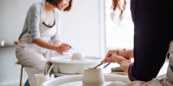 woman takes pottery class