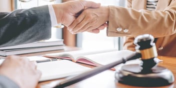 shaking hands after finalizing a divorce