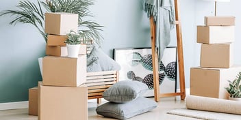 Stacked boxes and other household items preparing for a move