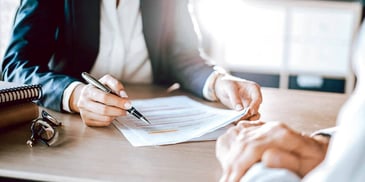 two people reviewing legal paperwork together