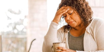upset woman sitting and thinking about what to do next