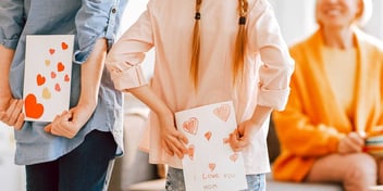 kids with special cards for their mom
