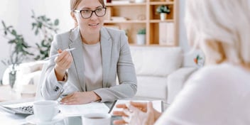 women meeting about the title on her marital house