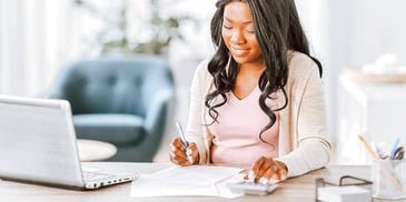 woman calculating her new post-divorce budget