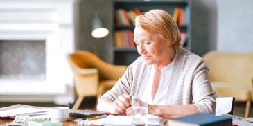 woman calculating her budget