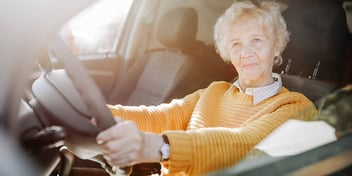 woman driving in her car
