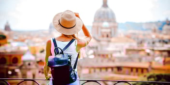 solo female traveler in a foreign country taking in city scenery