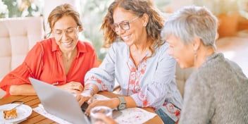women look at menu together