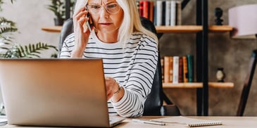 Woman checks her credit card balance during divorce