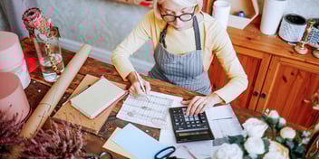 business owner working on paperwork 