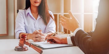woman meeting with a lawyer mediator about her divorce