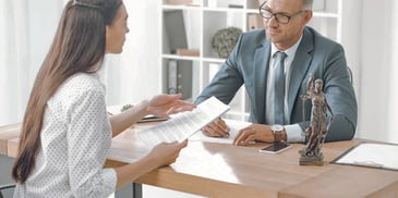 Woman meets with her divorce attorney