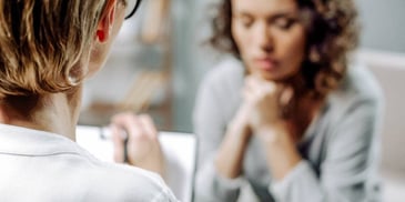 woman meeting with a lawyer for divorce coaching