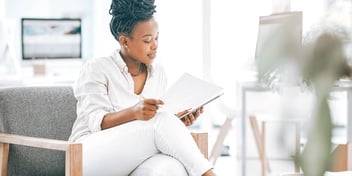 woman reviewing her insurance paperwork in a doctor's office