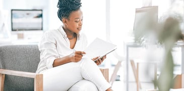 woman reviewing her insurance paperwork in a doctor's office