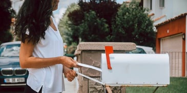 woman mailing divorce papers