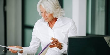 woman reviewing divorce paperwork