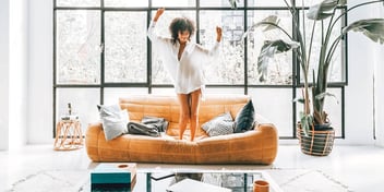 single woman having a solo dance party in her home