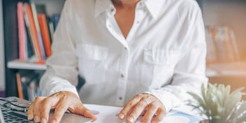 woman-sits-at-her-computer