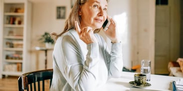 Woman talks to her ex on the phone after the divorce