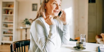 Woman talks to her ex on the phone after the divorce
