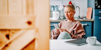 woman on her phone listening to divorce podcasts