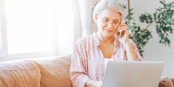 Woman uses laptop to complete financial disclosures
