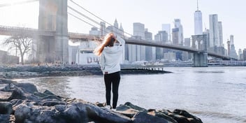 woman taking a walk as a self-care break from working in the city