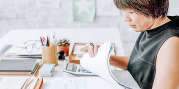 Woman looks at her bills after divorce