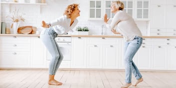 happy woman playing and enjoying themselves at home