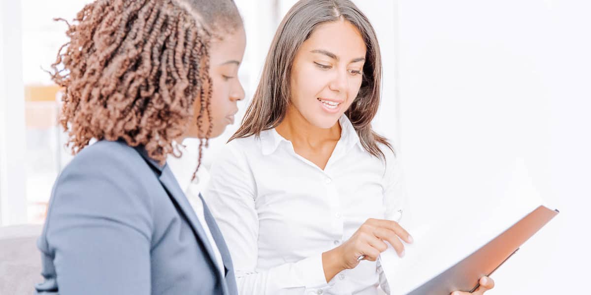 women-talking-planning-strategy women-talking-planning-strategy
