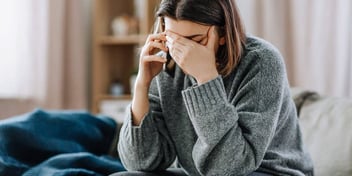 Young woman talking on the cell phone that is upset